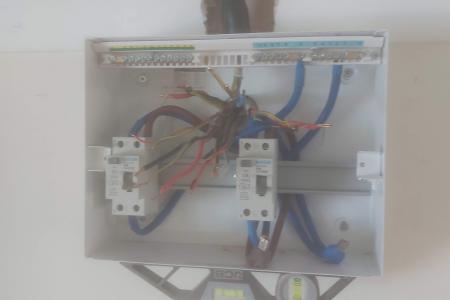 New consumer unit on the wall with all circuit tails ready to connect