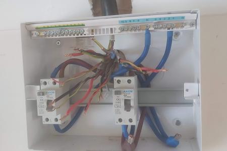 New consumer unit on the wall with all circuits tails ready to connect