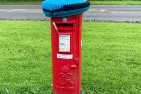 On my travels - crocheted  muppet on a post box